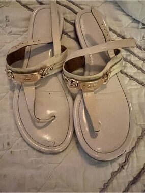 Coach Cream Patent Leather T-Strap Sandals with Gold Logo Plaque